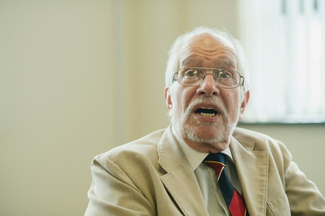 elderly man talking to advisor